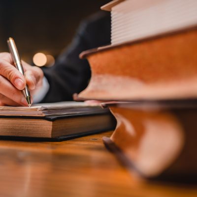 Successful businessmen's hand putting signing contract or agreement form, Lawyers or attorneys sign approval document, concept of justice, corporate, justice and rights, insurance, court and authority